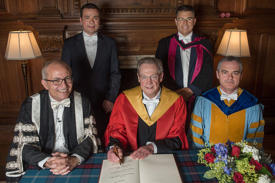After the ceremony awarding AAE Professor R. Byron Pipes, John L. Bray Distinguished Professor of Engineering, an honorary degree at the University of Edinburgh, Pipes (middle front) was joined by Edinburgh's Acting Vice Chancellor Charlie Jeffery (left front), head of Edinburgh's School of Engineering and Professor Conchúr M. Ó Brádaigh (right front), current Purdue doctoral student Eduardo Barocio (left rear) and another member of the University Court (right rear). All are shown wearing the white bow tie, an Edinburgh tradition for male graduation participants.