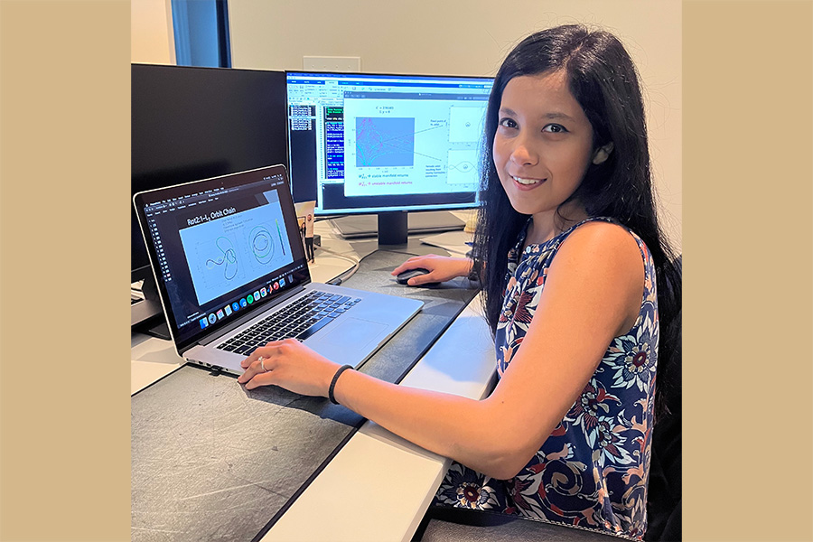 Maaninee Gupta seated in front of a laptop