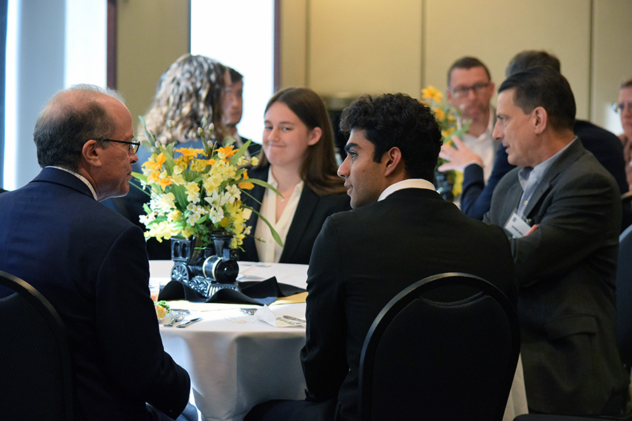 Purdue AAE students and representatives from Boeing and Rolls-Royce talking over lunch