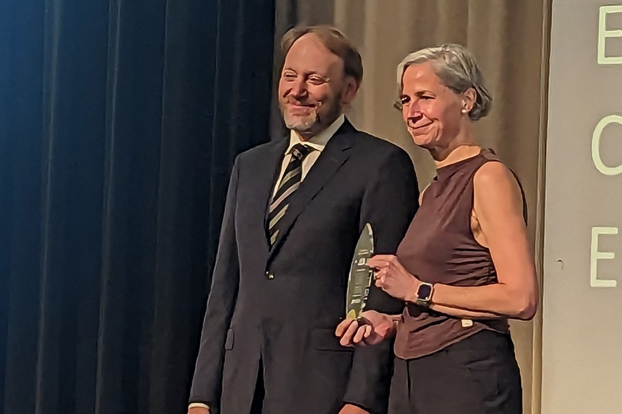 Marais receiving the Book of Great Teachers award