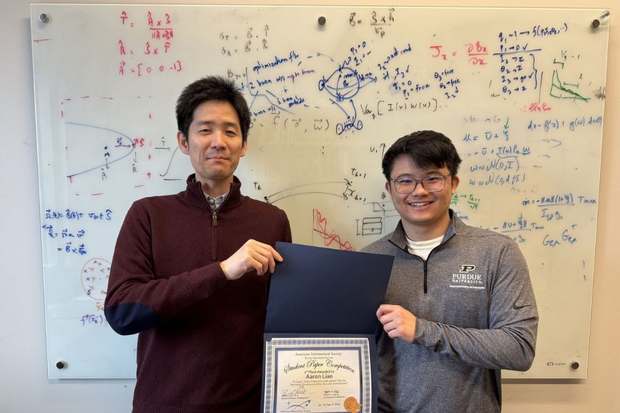 Ken Oguri and student receiving an award