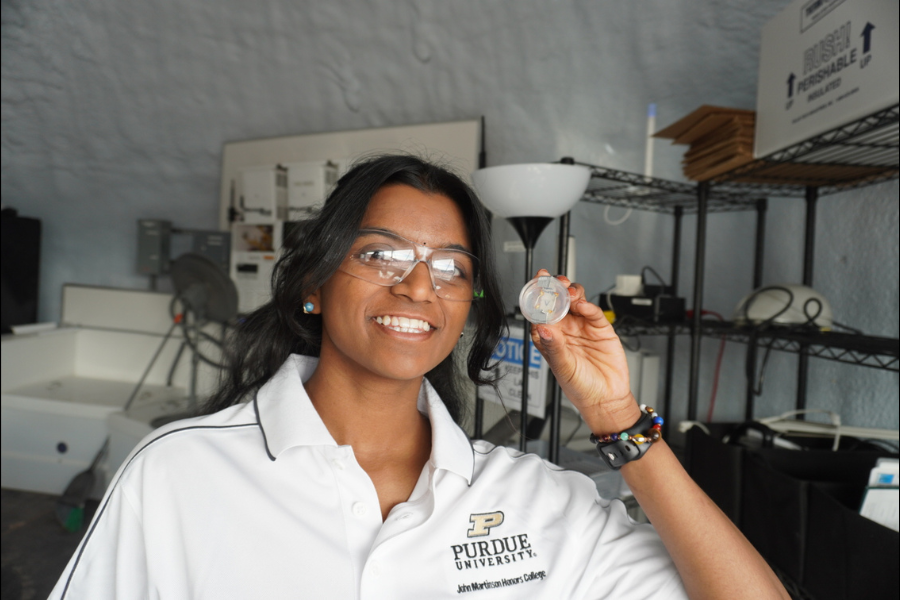 Researcher holding sensing material