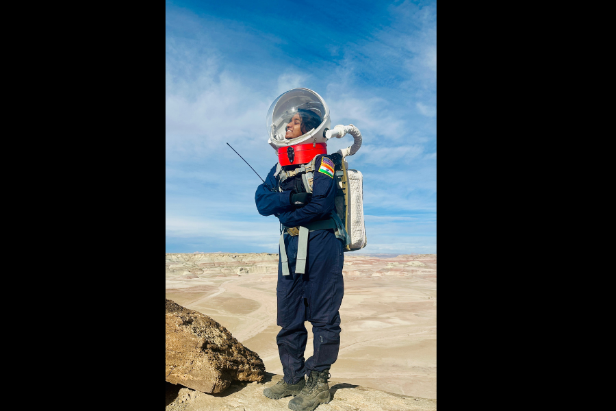 Analog astronaut overlooking terrain