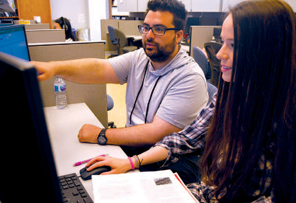 Lyles School of Civil Engineering PhD students Christos Gkartzonikas and Theodora Konstantinou work on estimating the environmental impact of inductive charging using Californias Emissions Factor Model.