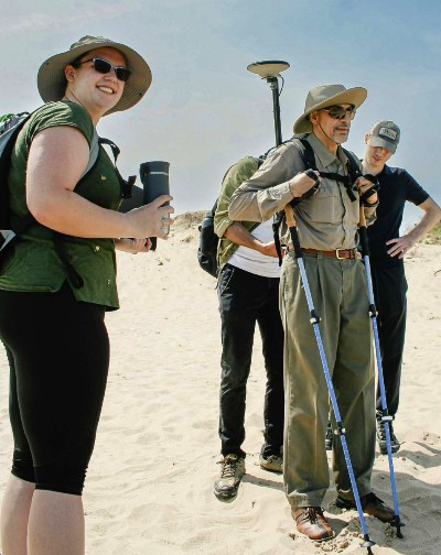 Undergraduate Hannah Tomkins assists Ayman Habib, the Thomas A. Page Professor of Civil Engineering, survey Lake Michigan.