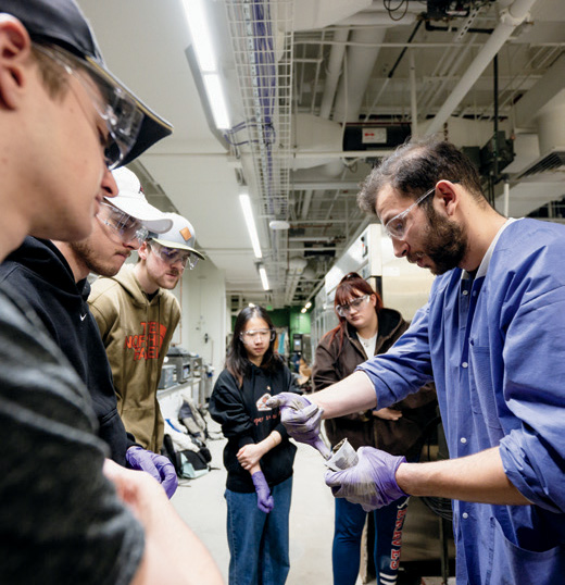 AlEddin Douba, a Lillian Gilbreth postdoctoral fellow in civil engineering, explains the characteristics of a specific concrete mixture to students in the 3D Printing for Infrastructure Applications course.