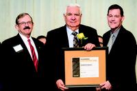 Rodolfo Gedeon receiving the 2018 CE Alumni Achievement Award: (L-R) Professor Robert Jacko, Rodolfo Gedeon, Professor Jon Fricker.