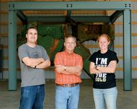 Graduate student Curtis Schroeder, Professor Robert Connor and graduate student Leslie Campbell in the Center for Aging Infrastructure's forensic specimen observation gallery, a structure made possible by a gift from Wabash National Corp.