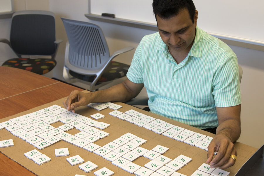 Professor Vilas Pol practicing for a world record attempt arranging all elements of the modern periodic table