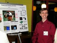 Thor Smith presenting the 2nd prize poster to conference attendees.