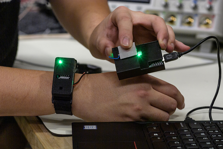 watch with chip touching laptop sensor