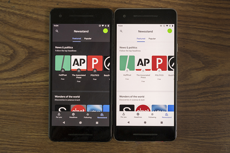cell phones demonstrating dark mode and light mode