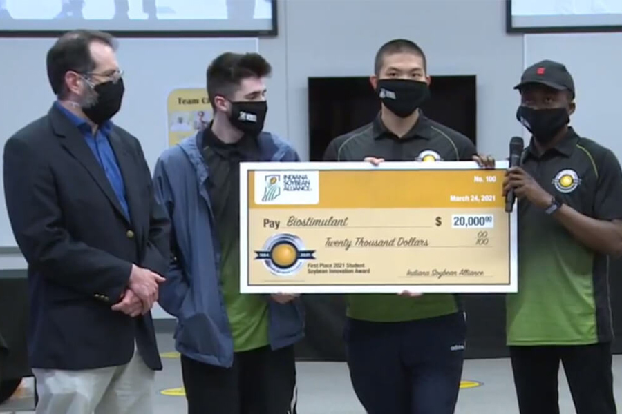 winning team photo with check