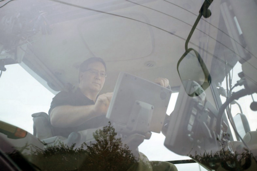 professor dennis buckmaster on a tractor