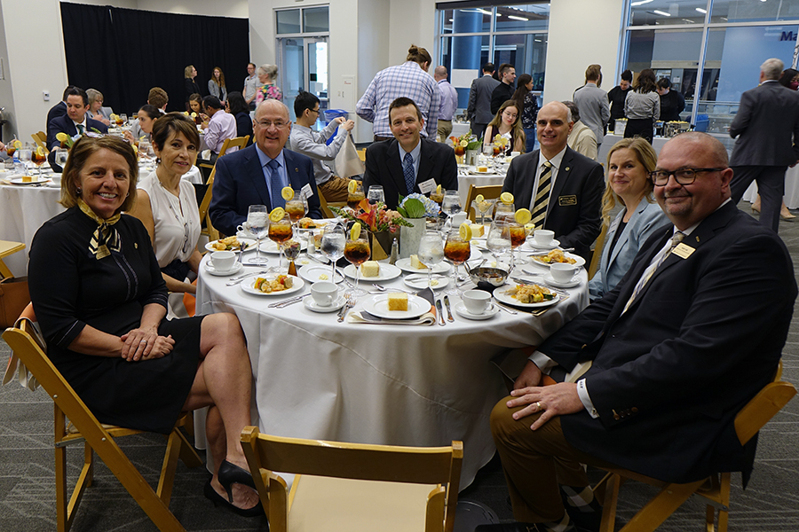 edmund schweitzer at a lunch held in his honor at the rice design studio