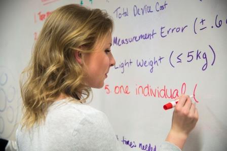 Caroline working on the dry-erase board