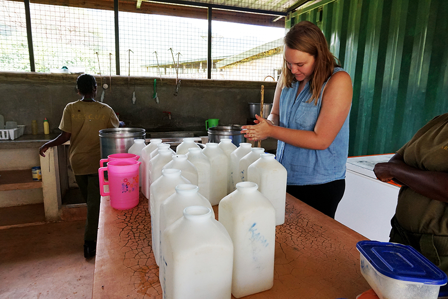 Margaret Hegwood in front of a bunch of jugs