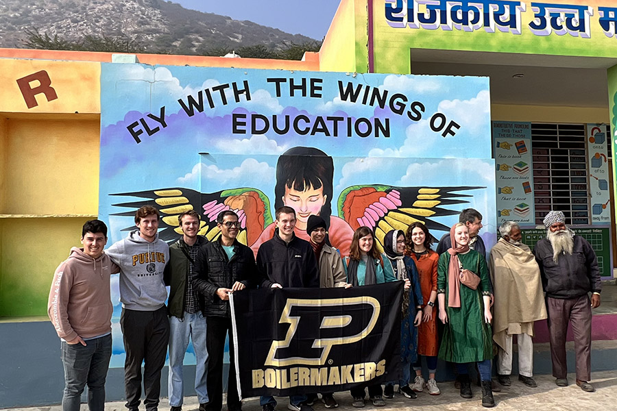 Students with the Purdue flag