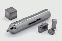 The element Tantalum, in a cube, a sphere, and cut pieces