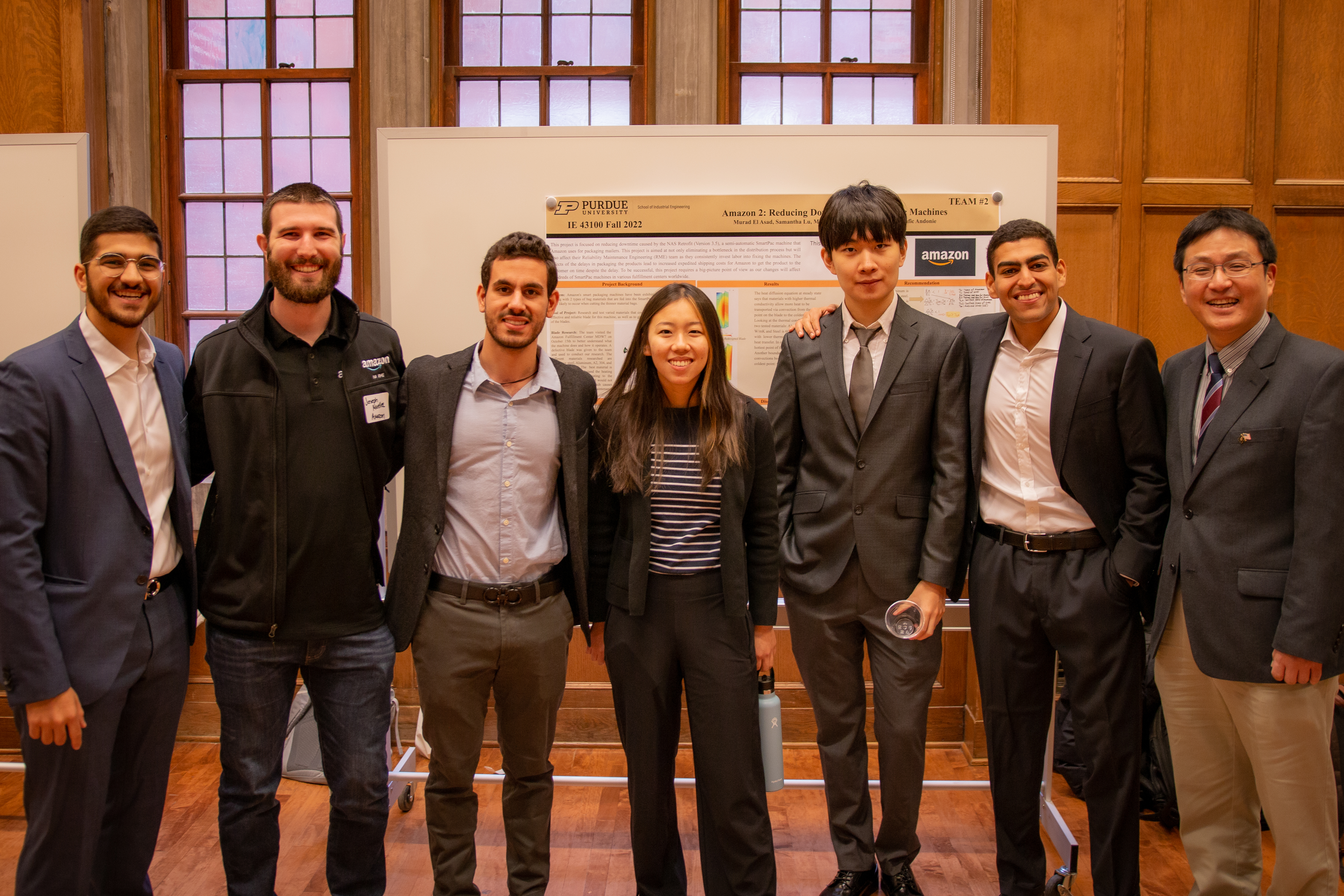 Team 2 poses for a photo with Amazon rep and Dr. Young-Jun Son.