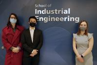 Natalie Koponen, Joshua Facello, Caroline Cudney standing at Grissom Hall entrance