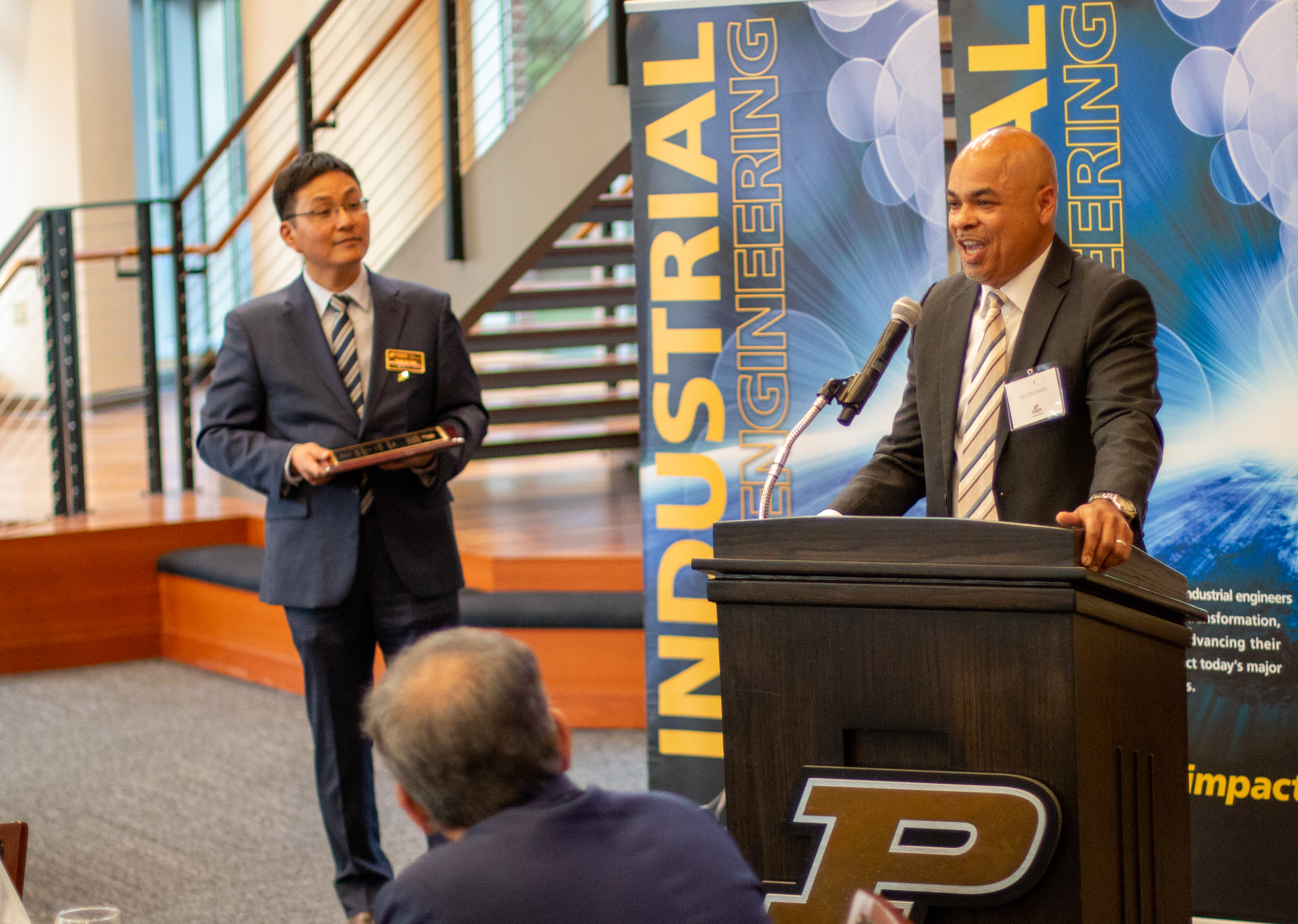 Selden Swain speaks to the guests in attendance with Dr. Son looking on.