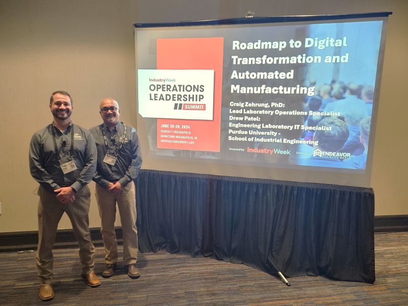 Photo of Dr. Craig Zehrung and Drew Patel at Operations Leadership Summit