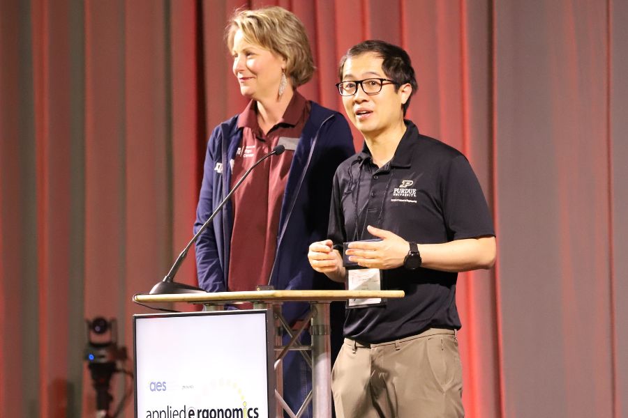 Assistant Professor Denny Yu accepting his most recent award