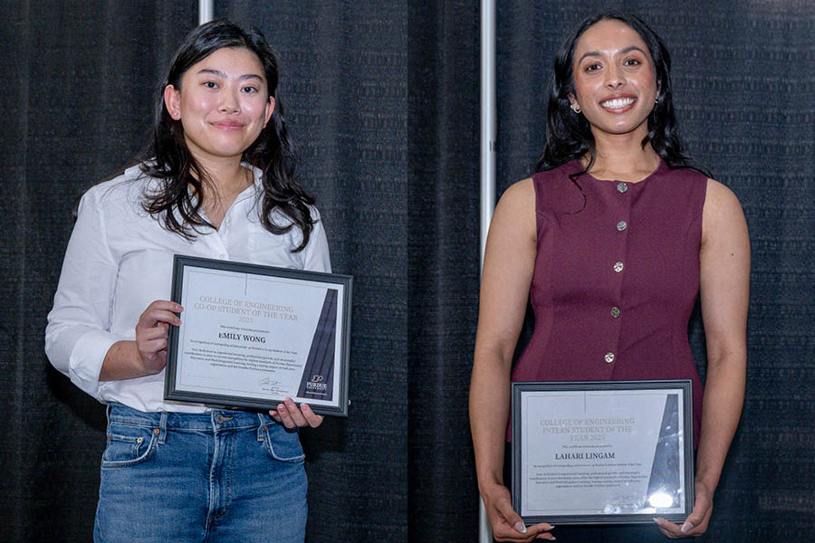 Two students holding certificates and smiling