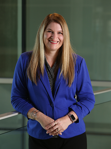 Woman with blonde hair wearing blue blazer