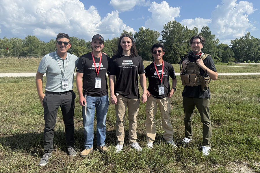 Group of men standing in a field